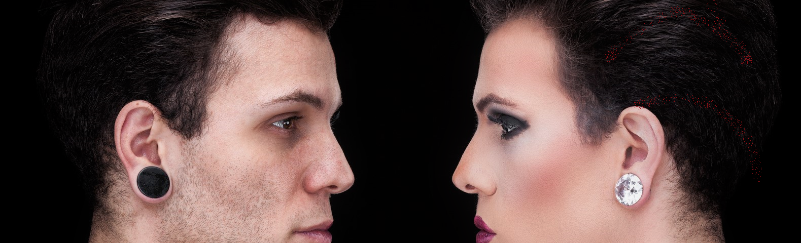 Profile of an ordinary  man facing a mirror image of himself with makeup on