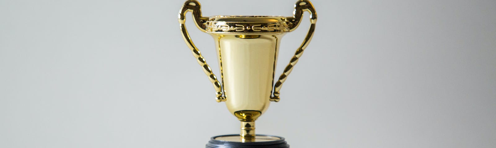 A trophy representing winning and putting yourself first in order to help others