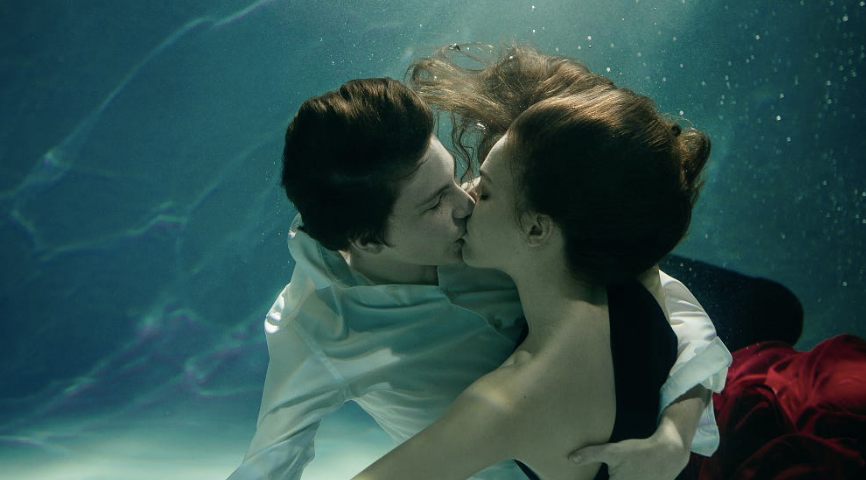 Couple kissing underwater