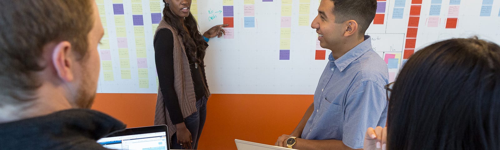 Colleagues collaborating on a project in an office