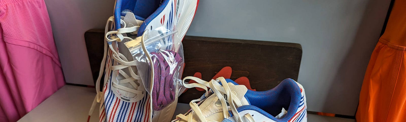 A pair of red, white, and blue running shoes