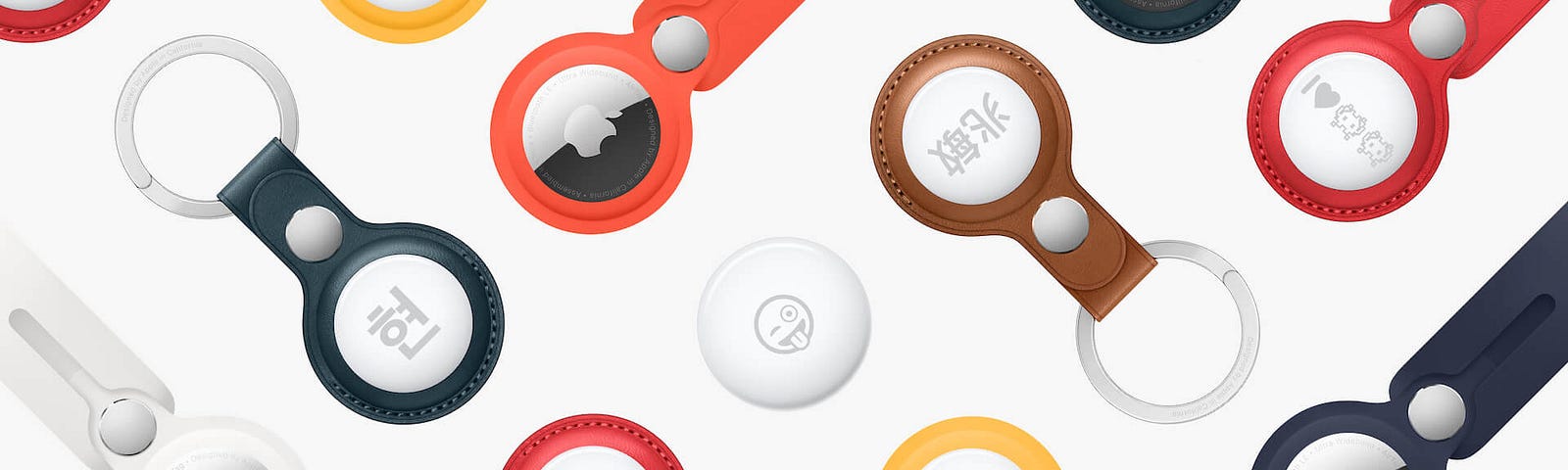 An assortment of AirTag accessories, individualized with various emoji and text.