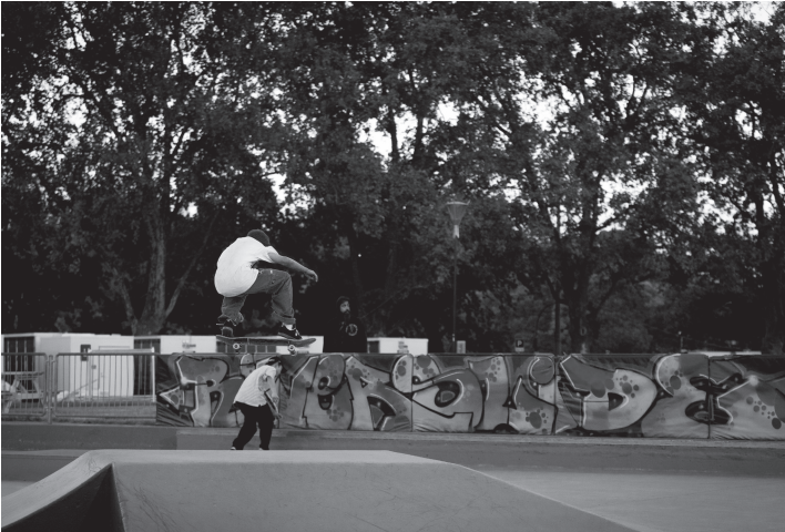 Boy doing skateboard trick. Photo by Gabriel Murdoch