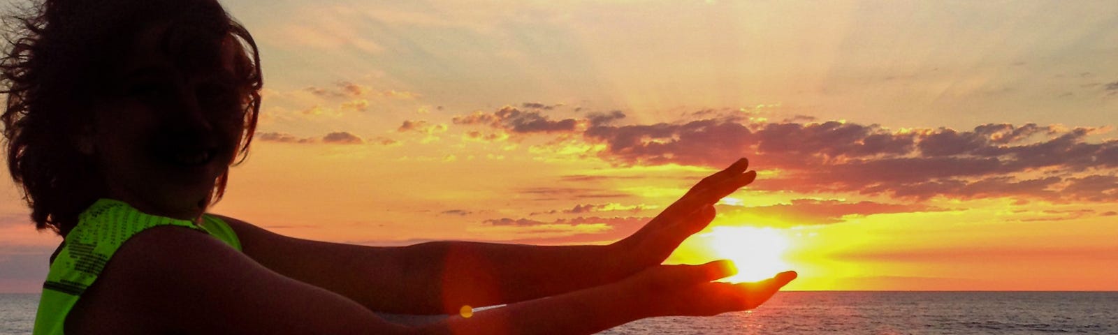 holding a sunset in hands, on the pier by the lake | nature photography | pockett dessert