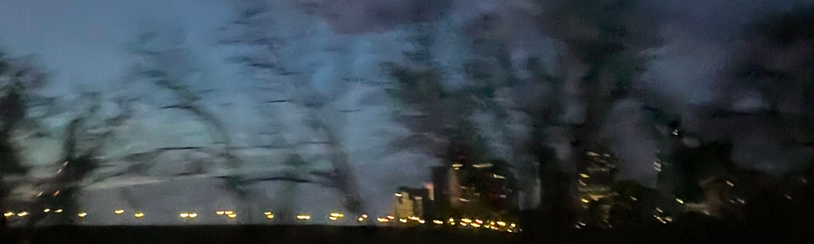 A blurred image of a bridge over the Potomac river at seven in the morning.