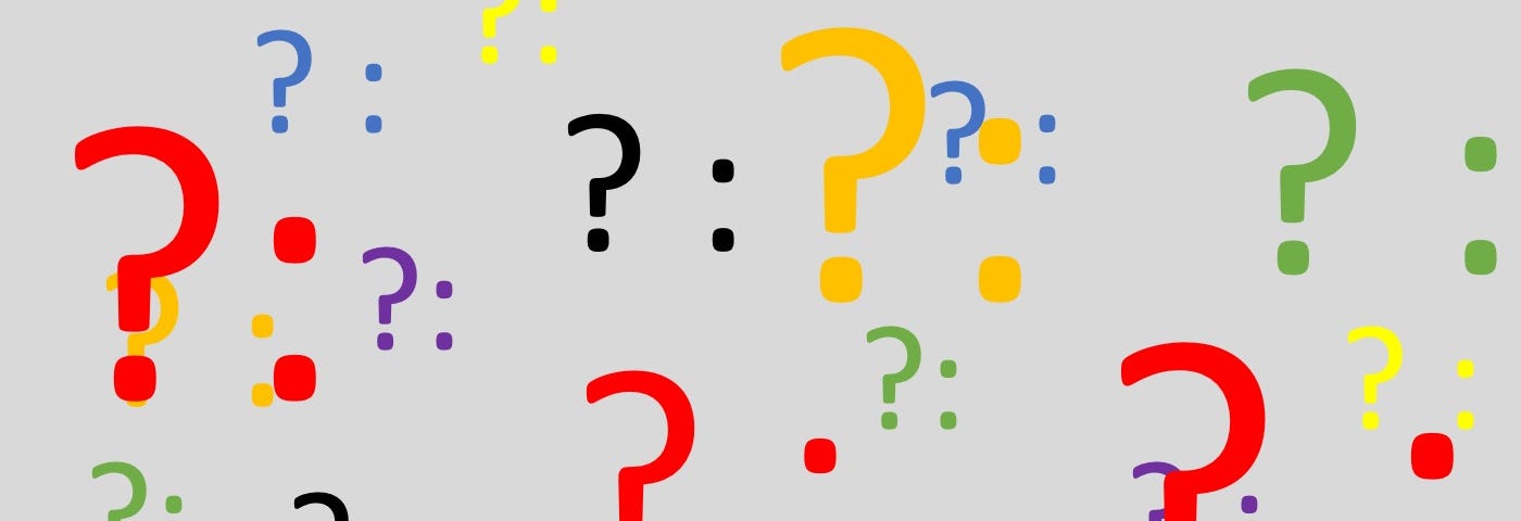 Question marks and colons in different colors and sizes
