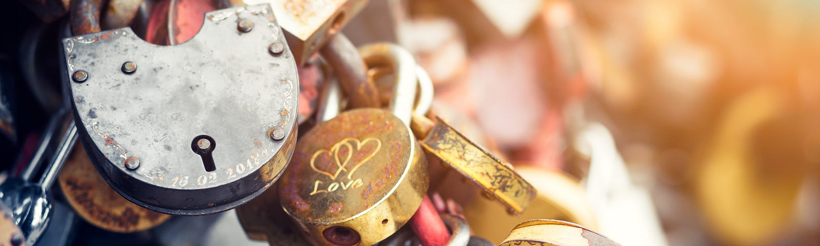 Metal locks. A bunch of locks. Heart locks