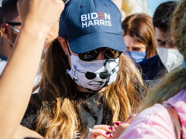 A masked Joe Biden supporter at a rally in 2020.