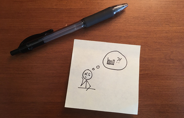 Drawing of a stick-figure person pondering a bar chart. Image drawn on a sticky note placed on a desk beside a black pen.