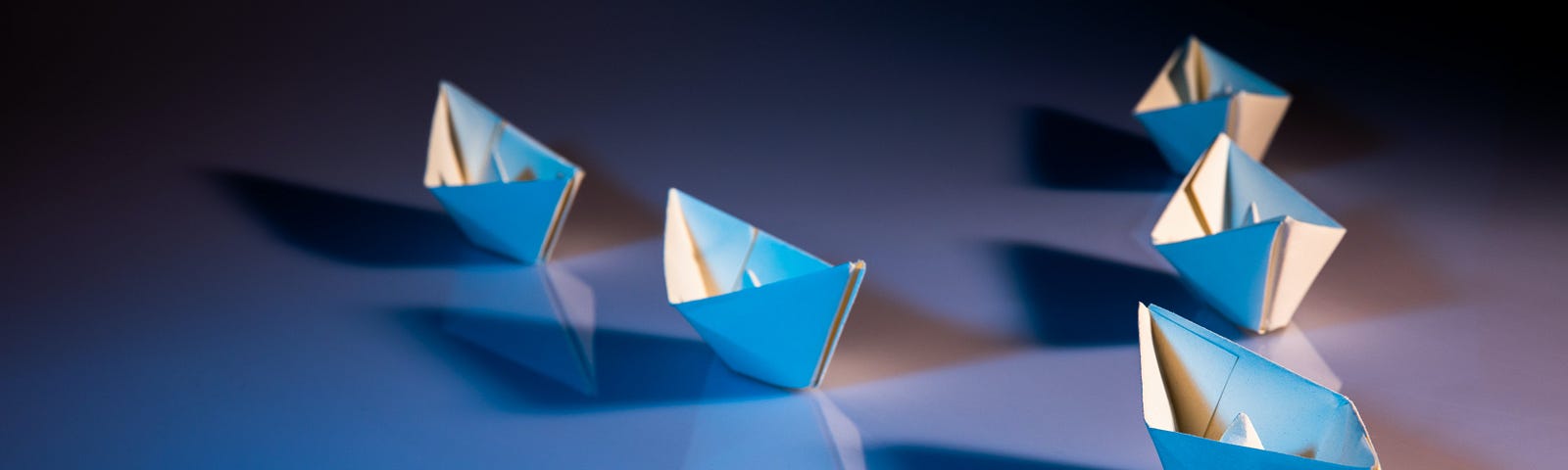 Origami boats in formation