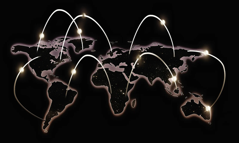 A dark black map of the world showing arcs of bright lights connecting one continent to the other