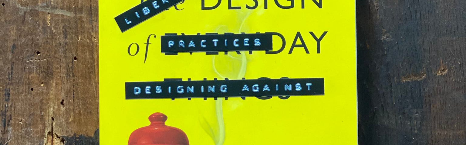 A softcover copy of the book The Design of Everyday Things, which has been altered with retro stick-on embossed letter strips, so the title now says, “Literatory Design Practices: Designing Against” and the authors now appear to be “Liz Jackson and Alex Haagaard”
