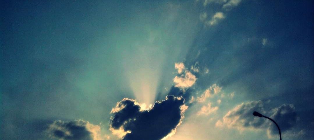 Sunset with a heart shaped cloud in front of Sun