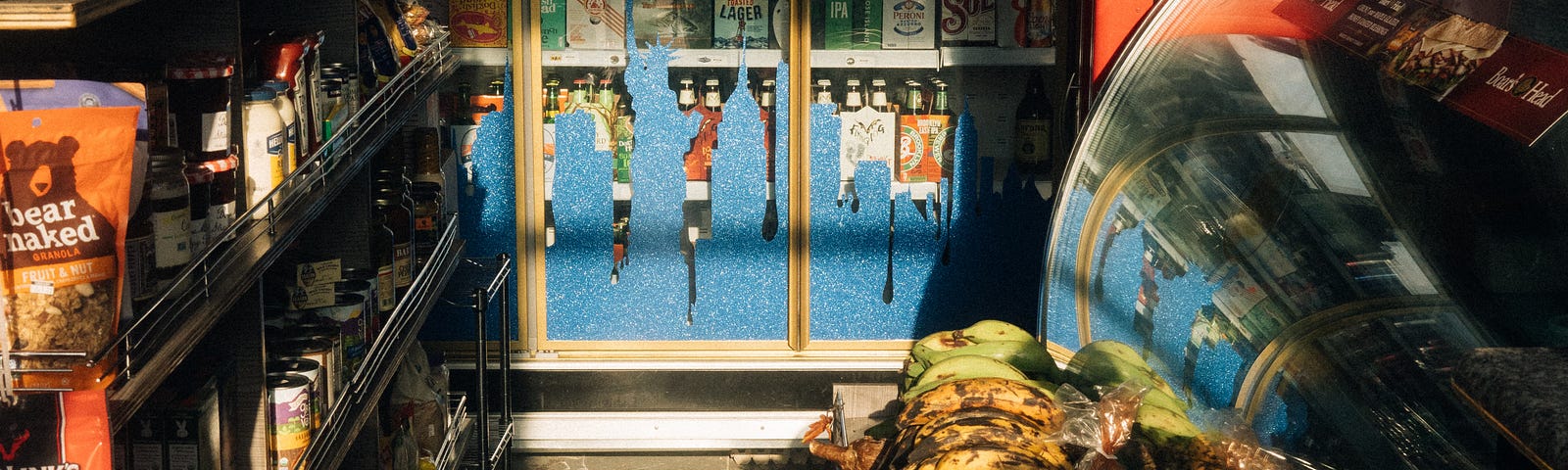 A dark and empty store with bananas on display