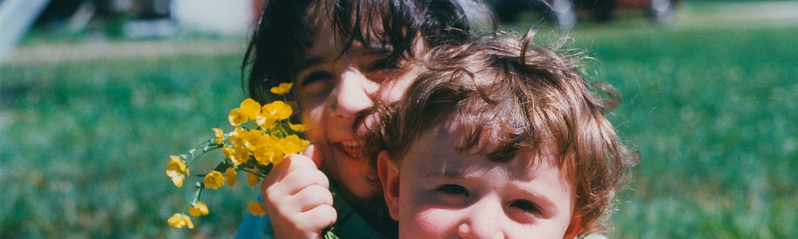 Two children, little boy in front, little girl behind