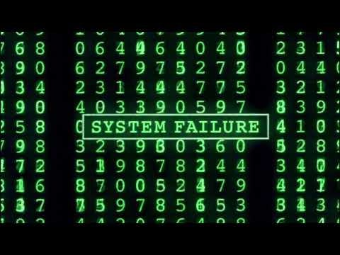 screen shot from a video clip of the end of The Matrix — with columns of numbers and an error message over them reading “system failure”