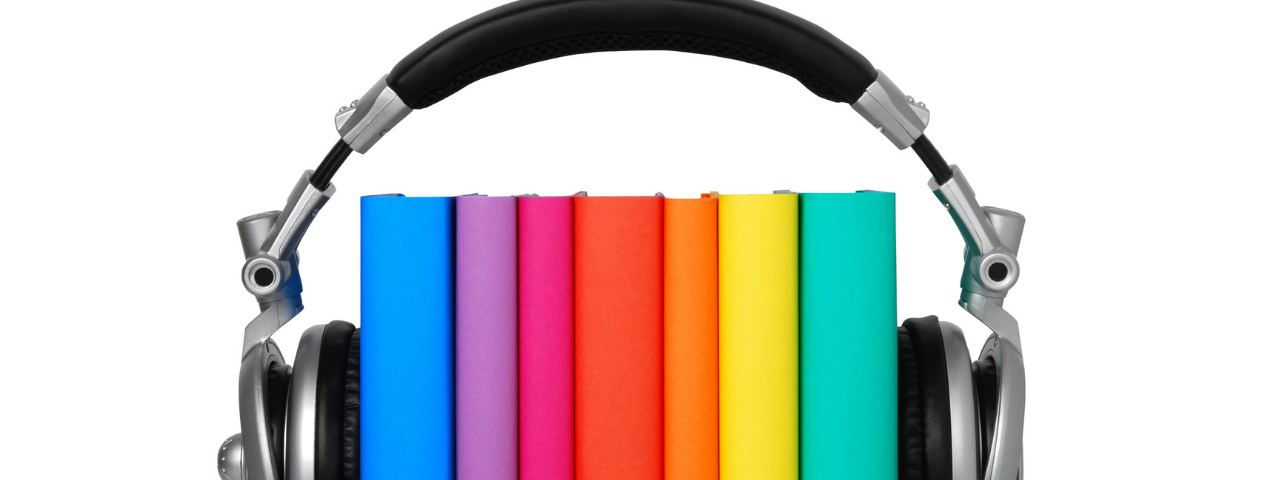 Rainbow-colored books and headphones — How I Make Audiobooks For Free on Amazon ACX