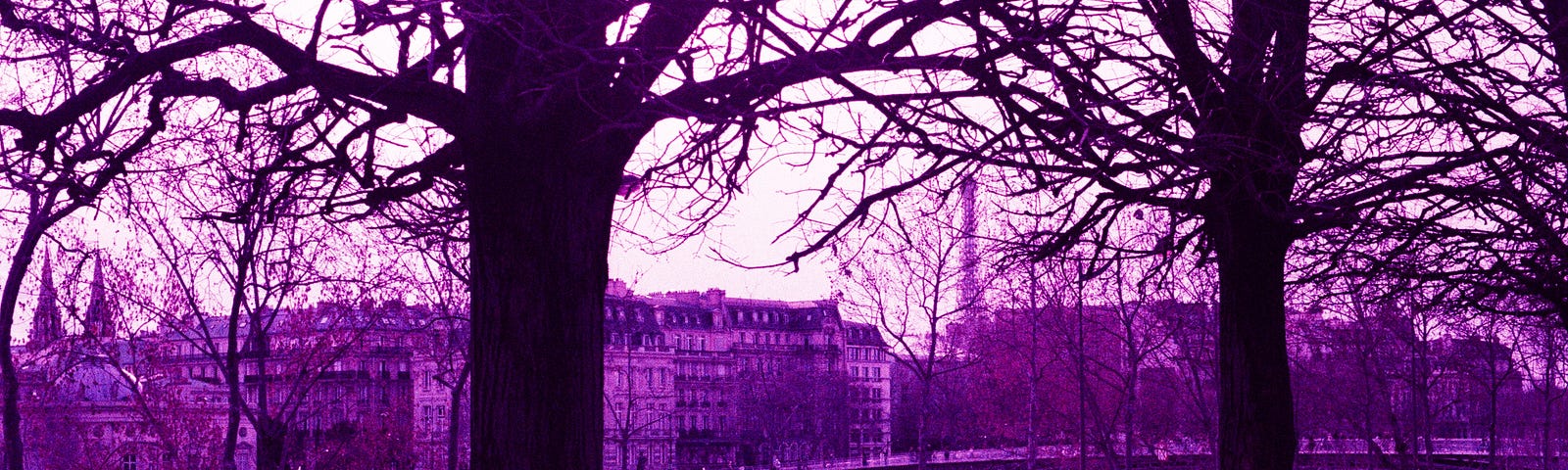 A woman takes in a view of Paris from an elevated position in the Jardin des Tuileries.