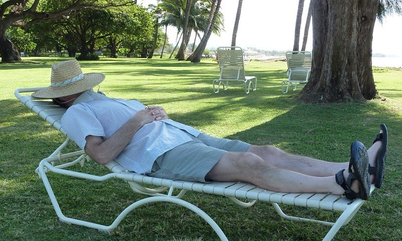 author’s husband relaxing in a lounge chair