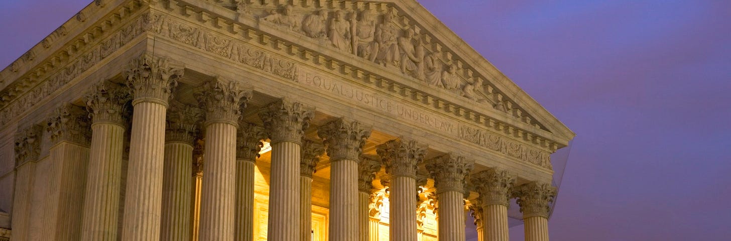 supreme Court Bldg — lit up at night,