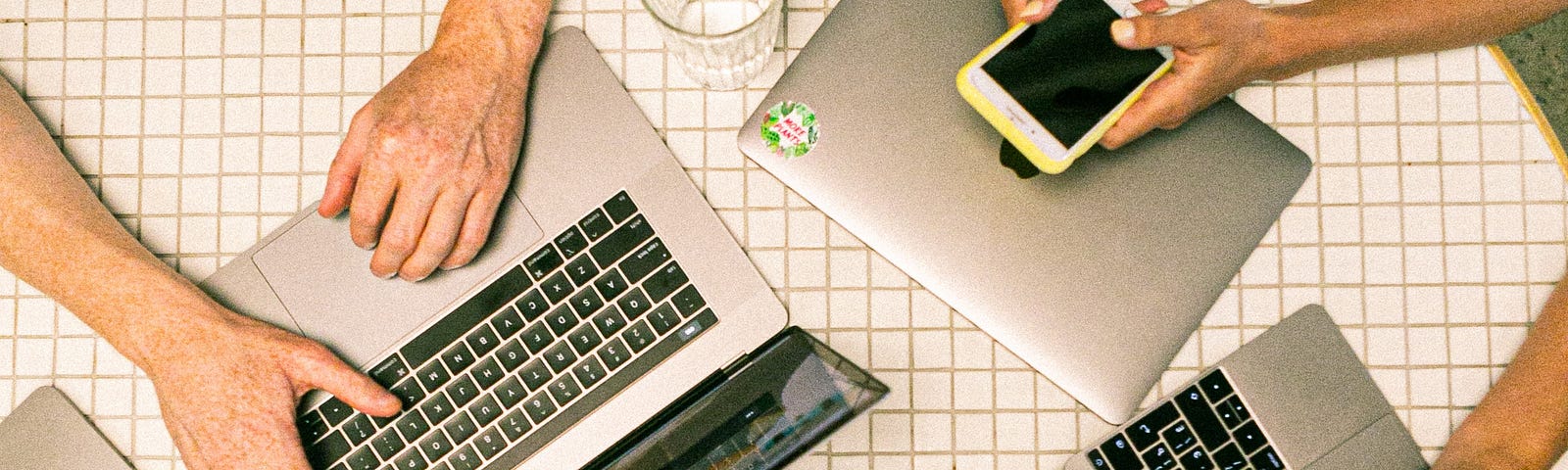 pic of 3 people working on their laptops