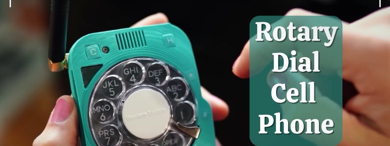 Hands holding a rotary design cell phone with words “Rotary Dial Cell Phone”