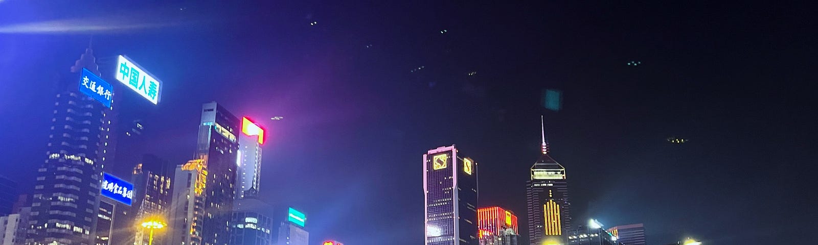 Victoria harbour at night — Photo by author