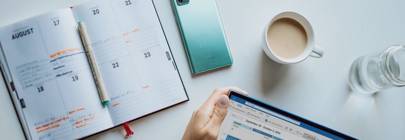 Cover image. A person checking a calendar on a tablet device.