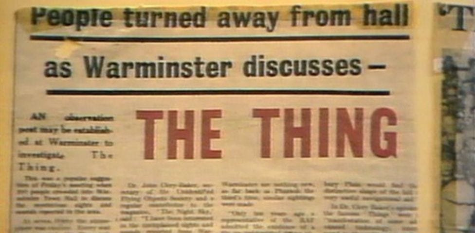 Screen shot, still from a video showing a newspaper headline reading ‘People turned away from hall as Warminster discusses — THE THING’, from 1965.