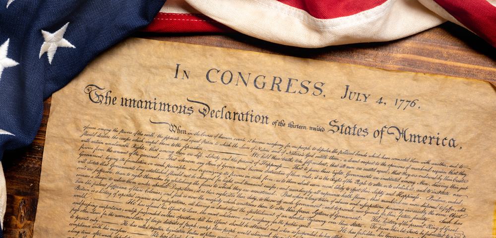 United States Declaration of Independence with a vintage American flag