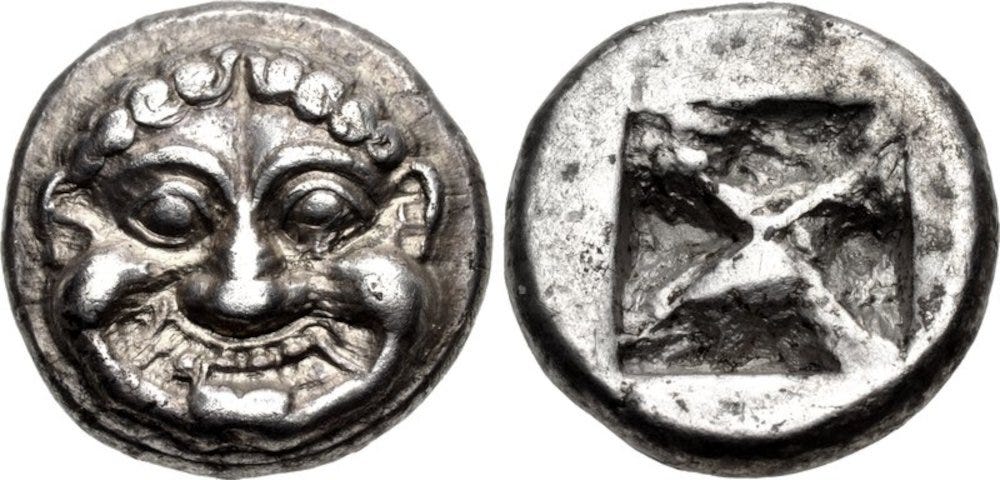 A coin shown with both sides, depicting an archaic Gorgoneion.