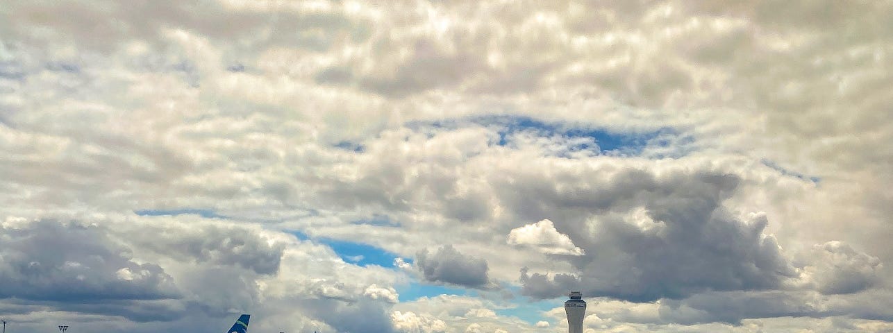 Planes lined up on the runway at Seattle-Tacoma Airport.