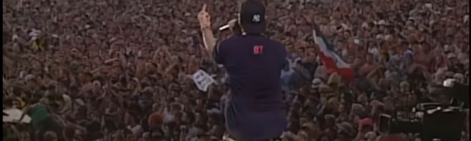 Fred Durst giving the finger to the crowd at Woodstock 99.