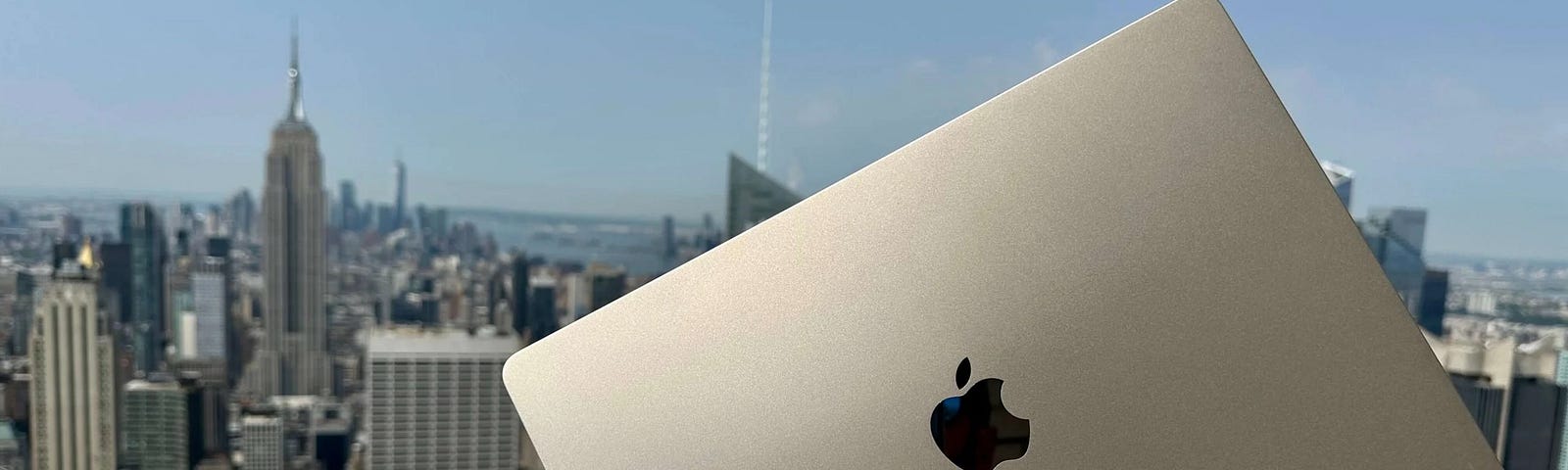 A 15-inch M2 MacBook Air held against New York Skyline