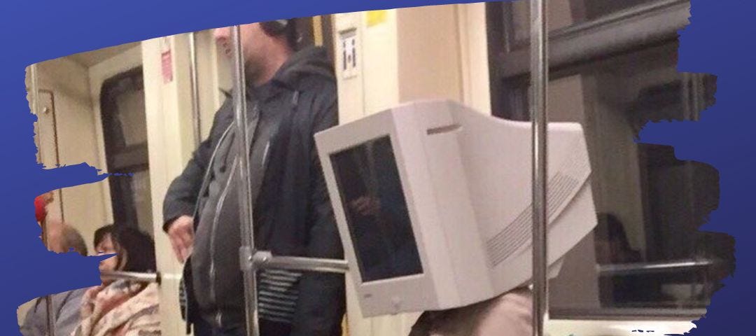 a lady on a subway with a computer monitor on her head