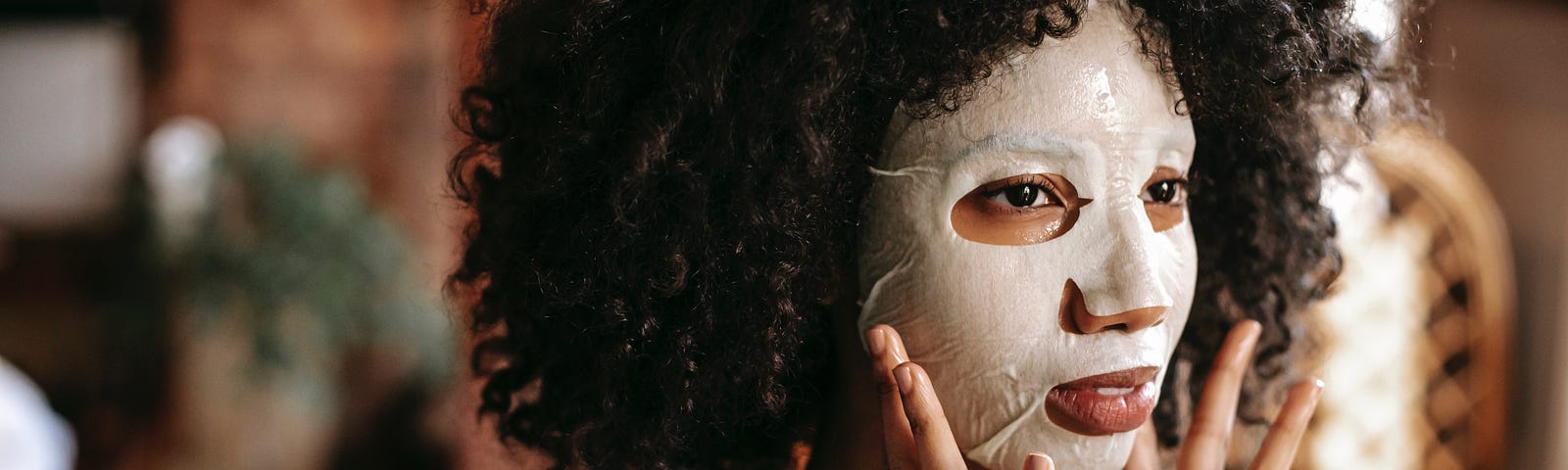 Woman putting on a face mask