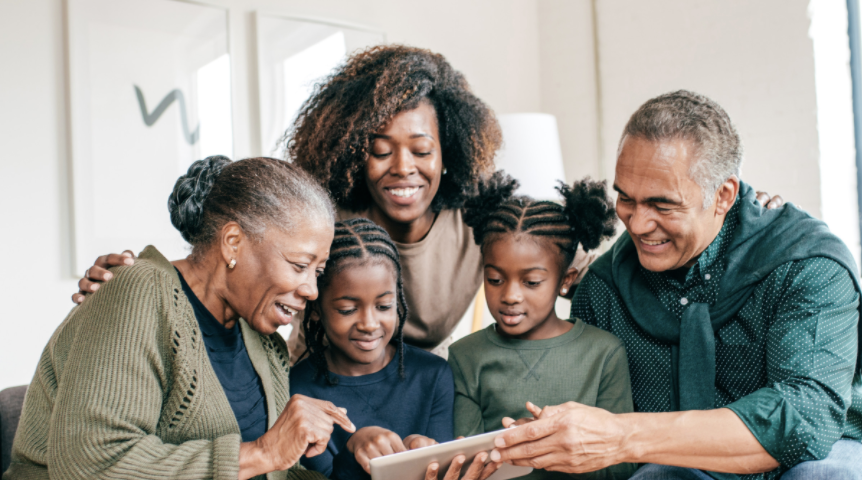 Family reading together on Simbi