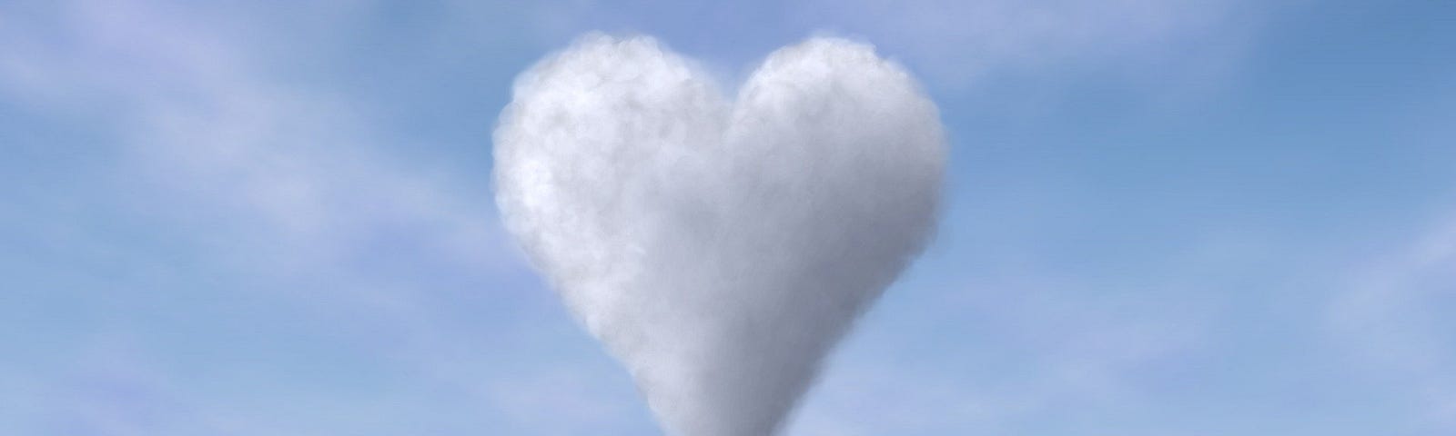 A white heart shaped cloud in a baby blue sky