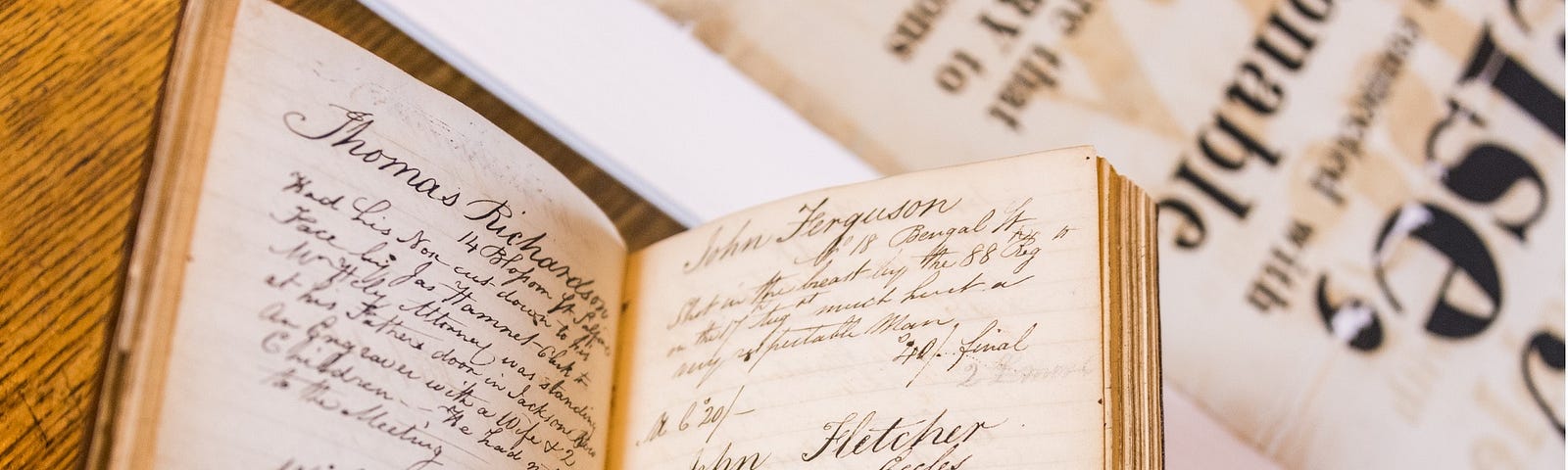 Photograph of two handwritten pages from the Peterloo Relief account book, featuring a list of recipients of the Peterloo relief fund giving their names, addresses, details of their injuries and the amount of money paid to them.