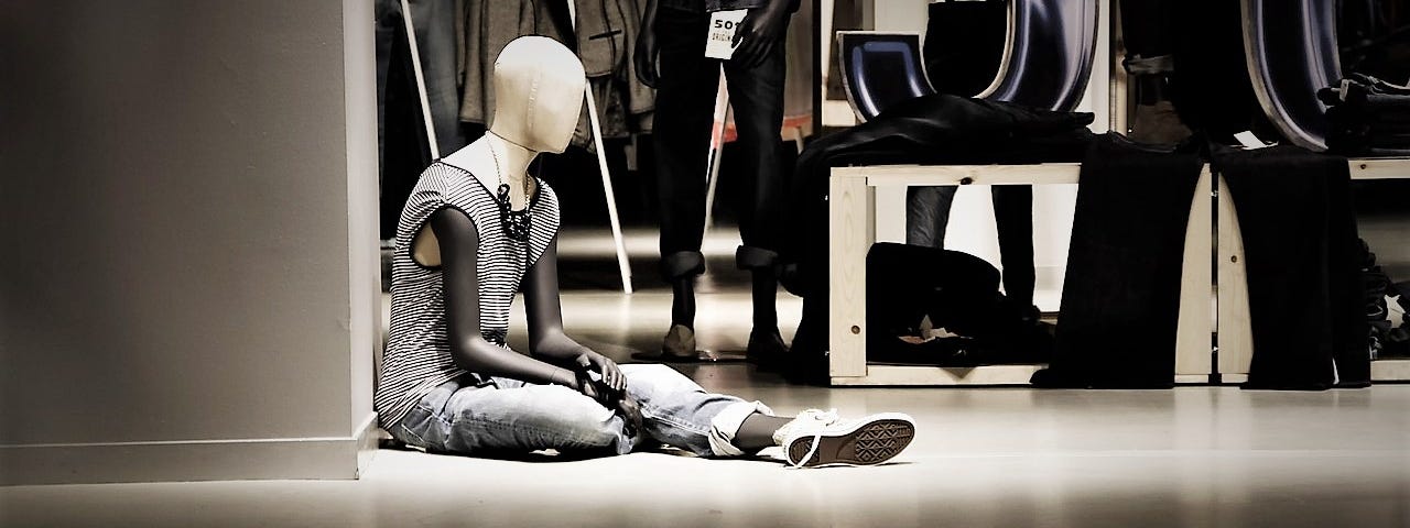 A dressed mannequin in a store floor.