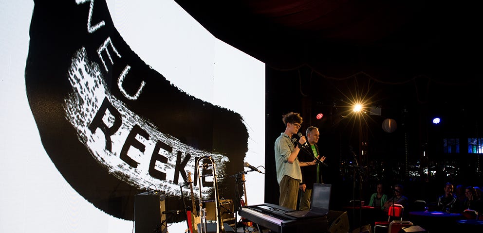 Neu! Reekie! stage with co-founders Michael Pedersen and Kevin Williamson performing