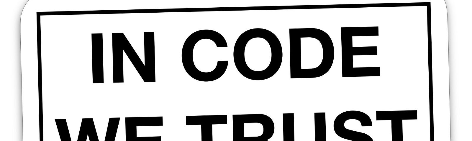 IMAGE: A white sticker with the words “In code we trust”