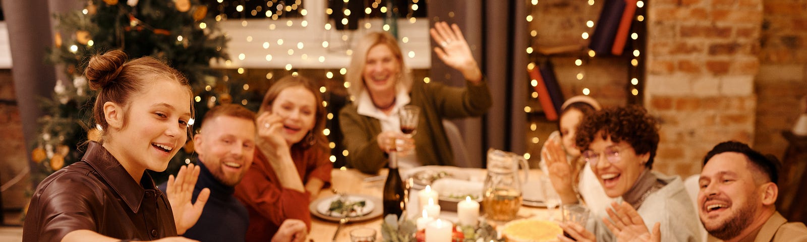 Family celebrating Christmas dinner while taking a selfie