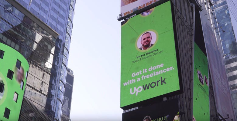 Victor Ramirez featured on an Upwork billboard in Times Square.