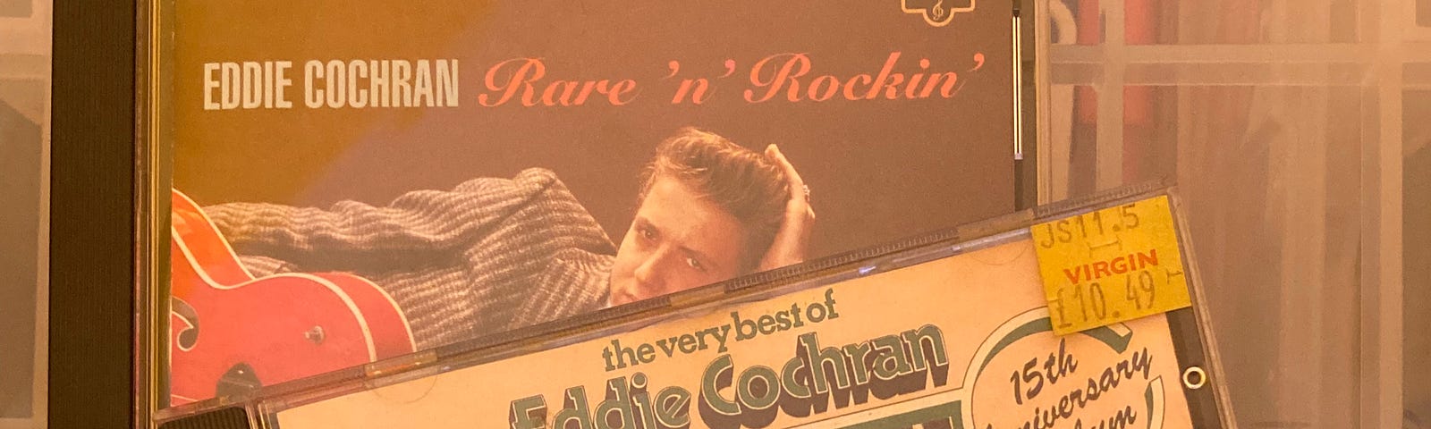 Author’s photo of the CD albums, The Very Best of Eddie Cochran (15th Anniversary Album) and Rare’n’Rockin’