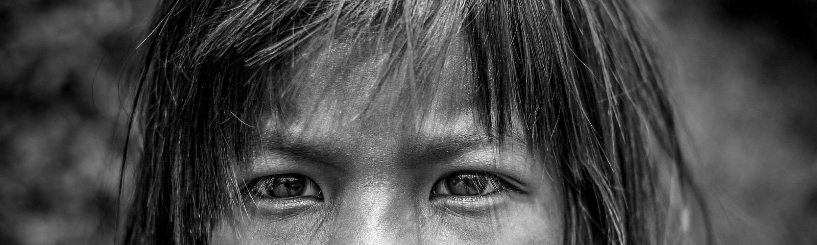 Black and white portrait of Nepalese child looking thoughtful