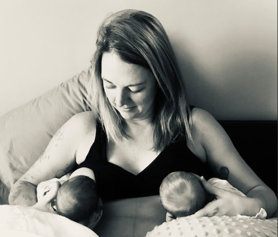 A woman nurses two infants simultaneously