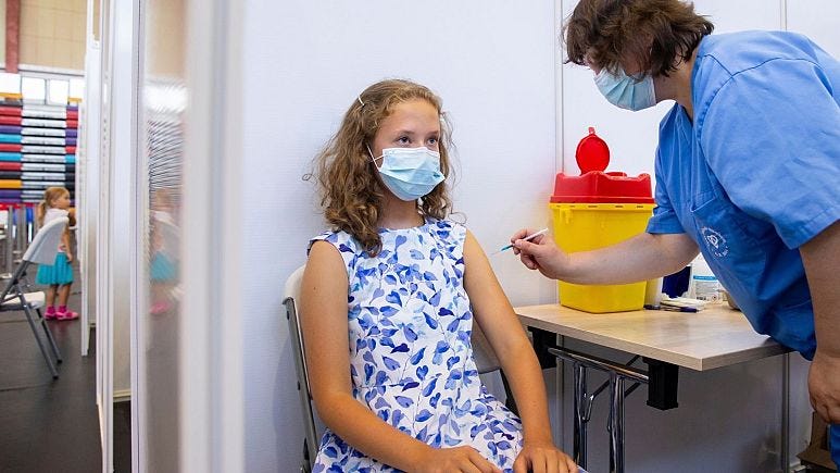 A young girl recieves a vaccine