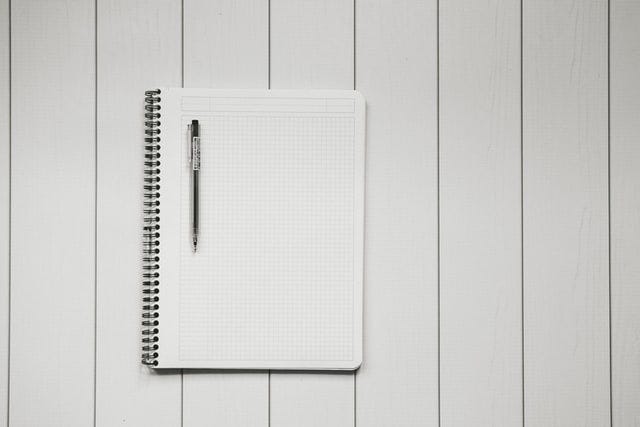 A blank sheet of paper in the notebook