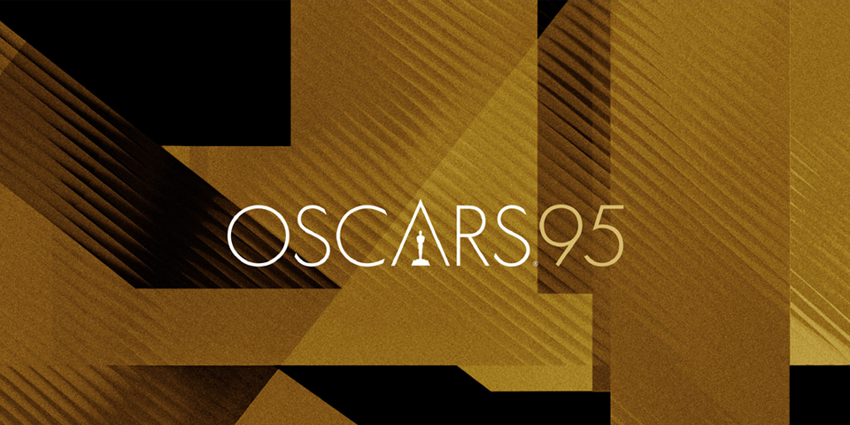 Gold and black geometric blocks in 1920s Bauhaus style in background. On top in thin white letters is the OSCARS95 logo